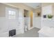 Clean bathroom with tiled floors, shower, bath, and wainscoting at 535 28Th N Ave, St Petersburg, FL 33704