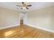 Bedroom with wood floors, soft tan walls, and a ceiling fan at 535 28Th N Ave, St Petersburg, FL 33704