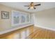 Bedroom with hardwood floors, a ceiling fan, and lots of natural light at 535 28Th N Ave, St Petersburg, FL 33704