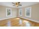 Spacious bedroom with wood floors and three windows for natural light at 535 28Th N Ave, St Petersburg, FL 33704