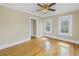 Bedroom featuring hardwood floors, a ceiling fan, and large windows at 535 28Th N Ave, St Petersburg, FL 33704