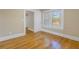 Sun-filled bedroom with wood floors and a view to the hall at 535 28Th N Ave, St Petersburg, FL 33704