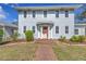 Charming two-story home with a landscaped yard and inviting brick walkway leading to the front door at 535 28Th N Ave, St Petersburg, FL 33704