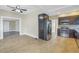 View of the updated kitchen with stainless steel appliances and wood-look tile floors at 535 28Th N Ave, St Petersburg, FL 33704