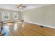 Large living room with hardwood floors, windows providing natural light, and a doorway at 535 28Th N Ave, St Petersburg, FL 33704