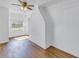 Bright living room with wood floors, ceiling fan and brick fireplace at 535 28Th N Ave, St Petersburg, FL 33704