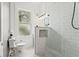 Modern bathroom featuring a sleek glass shower, white subway tile and ample natural light at 5807 N Branch Ave, Tampa, FL 33604