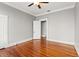 Spacious bedroom with hardwood floors, neutral walls, and two closets at 5807 N Branch Ave, Tampa, FL 33604