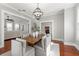 Dining room featuring a wooden table, upholstered chairs, and view into kitchen at 5807 N Branch Ave, Tampa, FL 33604