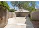 An open-air carport/garage including a basketball hoop above the entrance at 5807 N Branch Ave, Tampa, FL 33604