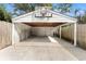 Open-air carport/garage includes a basketball hoop above the entrance at 5807 N Branch Ave, Tampa, FL 33604