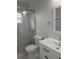 Modern bathroom featuring a glass-enclosed shower and clean, white fixtures at 6008 Memorial Hwy, Tampa, FL 33615