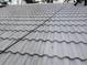 Close-up view of a light gray tile roof with a wire running across the tiles at 6008 Memorial Hwy, Tampa, FL 33615