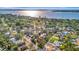 Scenic aerial perspective of a tranquil waterfront neighborhood, featuring charming residences and vibrant trees at 612 Montezuma Dr, Bradenton, FL 34209