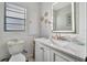 Bright bathroom featuring a vanity with modern finishes and a decorative mirror at 612 Montezuma Dr, Bradenton, FL 34209