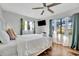 Bright bedroom featuring a bed with views from the plentiful windows with wood-look tile flooring at 612 Montezuma Dr, Bradenton, FL 34209