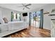 Bright bedroom featuring a bed with views from the plentiful windows with wood-look tile flooring at 612 Montezuma Dr, Bradenton, FL 34209