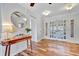 Bright foyer featuring beautiful wood floors, a decorative table, and double entry doors at 612 Montezuma Dr, Bradenton, FL 34209