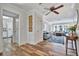 Bright living room showcases wood floors, neutral walls, and direct access to the kitchen for easy entertaining at 612 Montezuma Dr, Bradenton, FL 34209