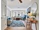 Inviting living room with a coastal theme, wood flooring, and plenty of natural light from the large windows at 612 Montezuma Dr, Bradenton, FL 34209