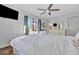 Bright bedroom featuring white walls, modern furnishings, and a ceiling fan at 612 Montezuma Dr, Bradenton, FL 34209