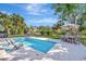 Beautiful backyard pool with comfortable in-pool seating and a spacious patio for entertaining guests at 612 Montezuma Dr, Bradenton, FL 34209