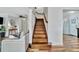 A wooden staircase ascends from the living room, featuring hardwood floors at 612 Montezuma Dr, Bradenton, FL 34209