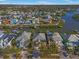 Stunning aerial view of colorful waterfront homes with private docks and lush landscaping on Apollo Beach at 6411 Grenada Island Ave, Apollo Beach, FL 33572