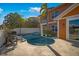 Beautifully landscaped backyard with a sparkling pool and outdoor entertainment space at 6411 Grenada Island Ave, Apollo Beach, FL 33572