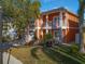 Elegant two-story home with a two-car garage, small balcony and beautifully landscaped yard at 6411 Grenada Island Ave, Apollo Beach, FL 33572