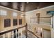 Foyer view from the top of the stairs showing the vaulted ceilings and bamboo wall decor at 6411 Grenada Island Ave, Apollo Beach, FL 33572