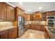 This kitchen has custom wood cabinets, stainless steel appliances, granite countertops, and tiled backsplash at 6411 Grenada Island Ave, Apollo Beach, FL 33572