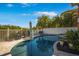 Well-maintained pool area with ample seating and lush landscaping at 6411 Grenada Island Ave, Apollo Beach, FL 33572