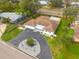 Scenic aerial view featuring a circular driveway, lush landscaping, and proximity to the neighborhood at 6655 Colony S Dr, St Petersburg, FL 33705