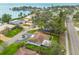 Stunning aerial view showcasing the coastal neighborhood, picturesque street, and perfectly manicured lawn at 6655 Colony S Dr, St Petersburg, FL 33705