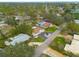 Wide aerial shot displays neighborhood, showcasing large lots, mature trees, and proximity to amenities at 6655 Colony S Dr, St Petersburg, FL 33705