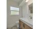 Bathroom features white countertop, wood cabinetry, and tiled floors at 6655 Colony S Dr, St Petersburg, FL 33705