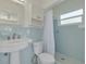 Vintage bathroom featuring blue tiling, updated sink, and shower at 6655 Colony S Dr, St Petersburg, FL 33705