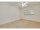 Bedroom with neutral walls and carpet and one large window for natural light at 6655 Colony S Dr, St Petersburg, FL 33705