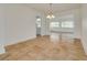 Bright dining room with tile flooring, pendant lighting, and an airy feel at 6655 Colony S Dr, St Petersburg, FL 33705