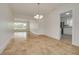 Cozy dining area featuring a stylish chandelier and an open layout at 6655 Colony S Dr, St Petersburg, FL 33705