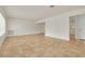 Spacious living room featuring neutral color palette and tile flooring throughout at 6655 Colony S Dr, St Petersburg, FL 33705