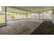 Large screened-in patio with concrete pavers and view of backyard at 6655 Colony S Dr, St Petersburg, FL 33705