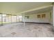 Spacious screened-in patio with concrete pavers and white ceiling at 6655 Colony S Dr, St Petersburg, FL 33705