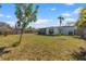 Large, fenced backyard with established greenery and mature trees at 6681 32Nd N Ave, St Petersburg, FL 33710