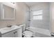 Updated bathroom with new vanity, toilet, and tiled shower-tub combination at 6681 32Nd N Ave, St Petersburg, FL 33710