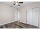 Bedroom with hardwood floors, ceiling fan, and a double-door closet at 6681 32Nd N Ave, St Petersburg, FL 33710