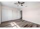 Bedroom with hardwood floors, ceiling fan, and a double-door closet at 6681 32Nd N Ave, St Petersburg, FL 33710