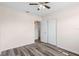 Bedroom with hardwood floors, ceiling fan, and a double-door closet at 6681 32Nd N Ave, St Petersburg, FL 33710