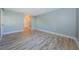 This bedroom features neutral paint and new floors, leading to a closet at 722 116Th Ave N # 2002, St Petersburg, FL 33716